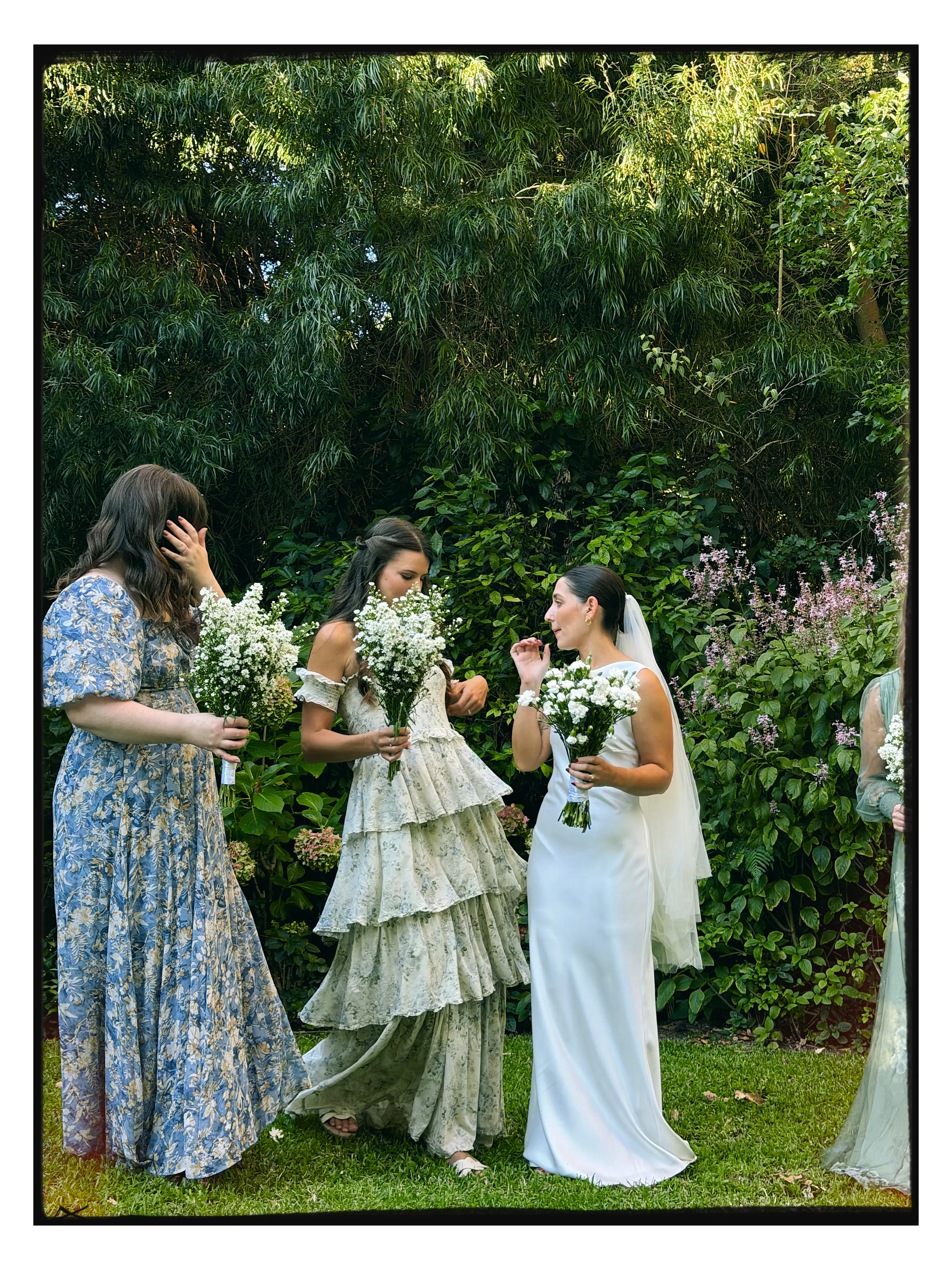 The bridal party in the garden