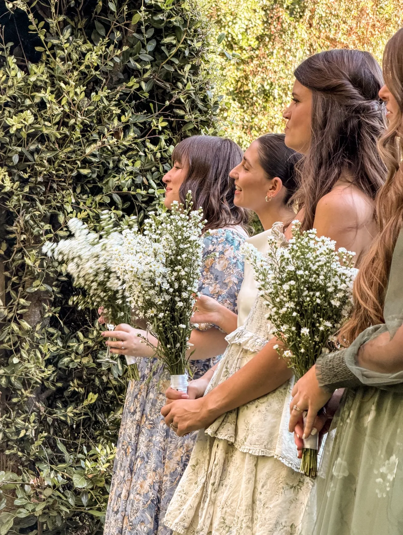 Bridesmaids gathered with their bouquets