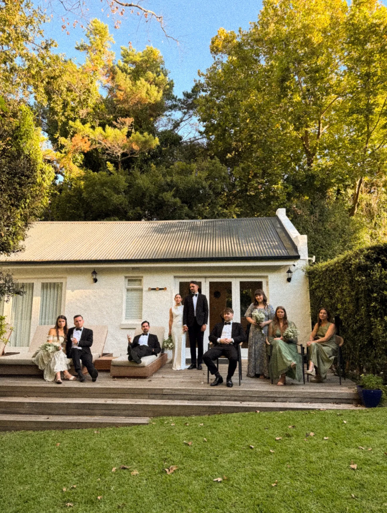 Guests on the lawn of a white country house