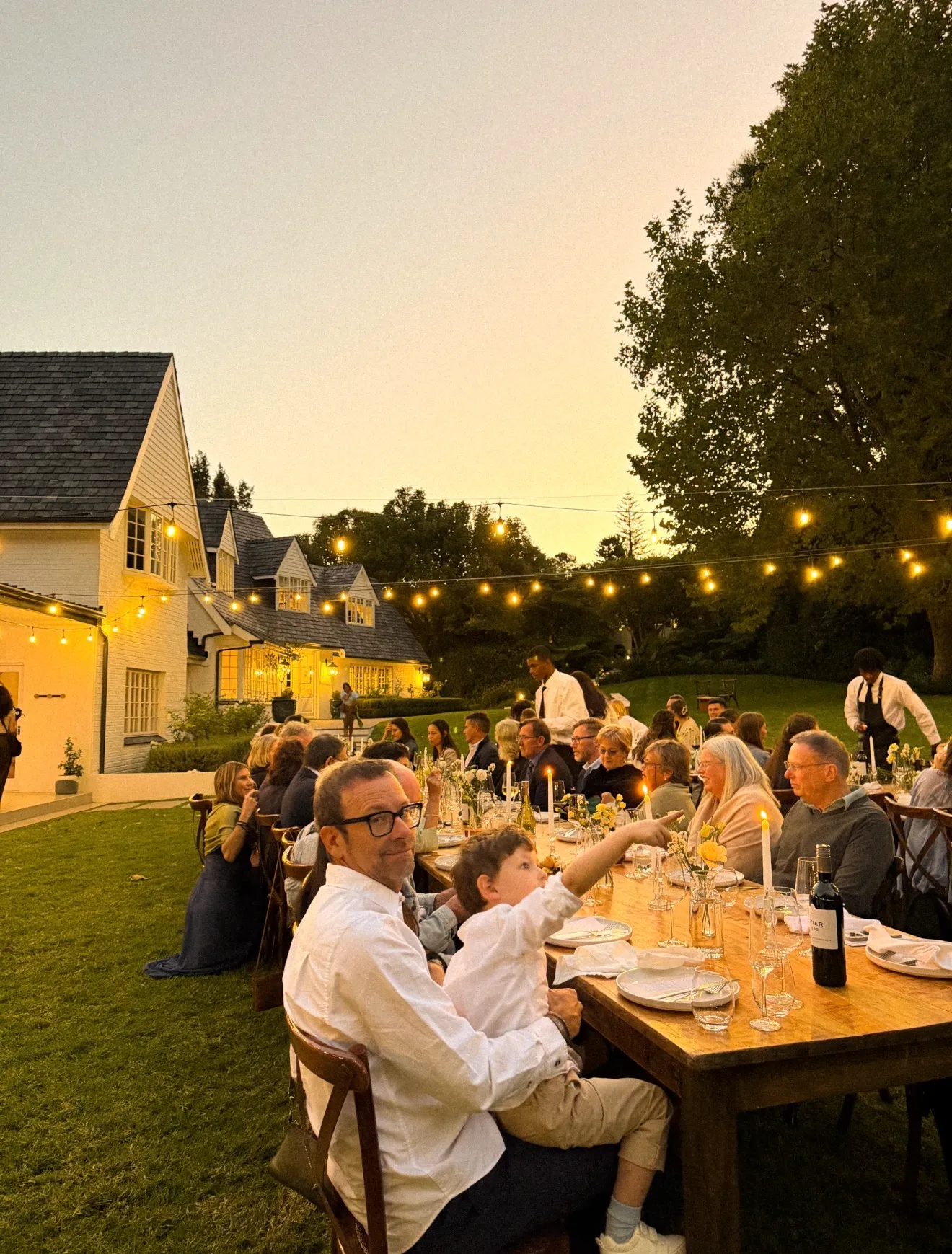 A long table set for an evening reception